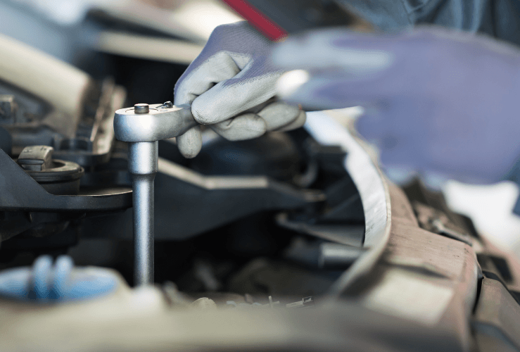 Mechanic fixing a van engine