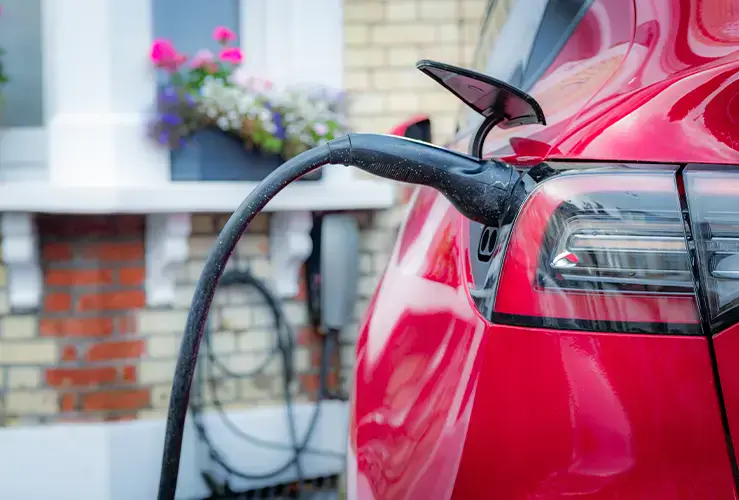 An electric car charging at home