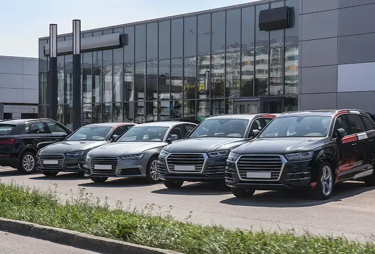 Cars parked up outside a showroom