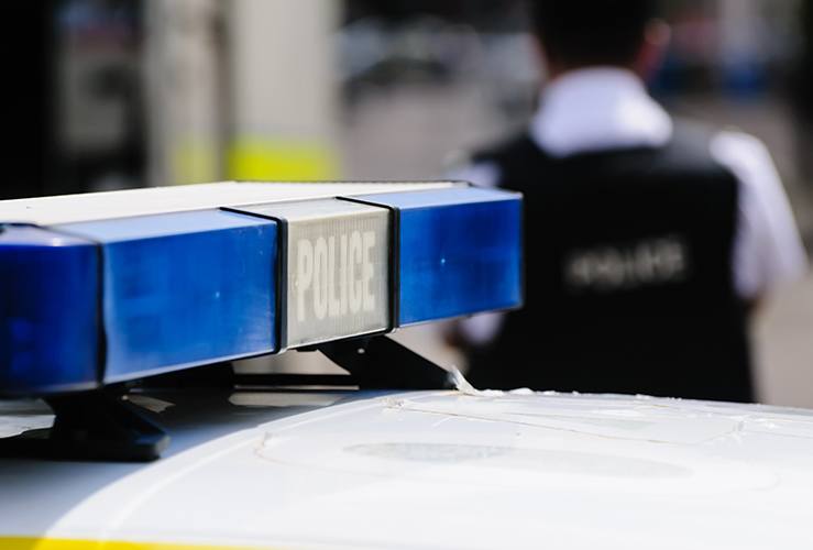 blue lights on the roof of a police vehicle
