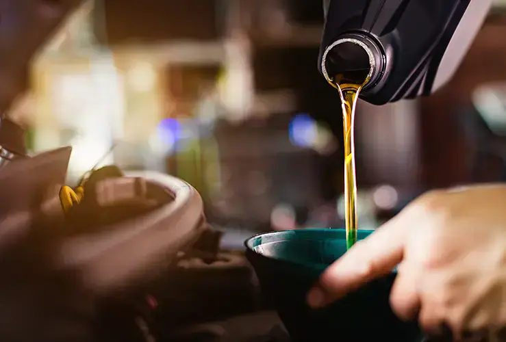 Topping up the oil in a car