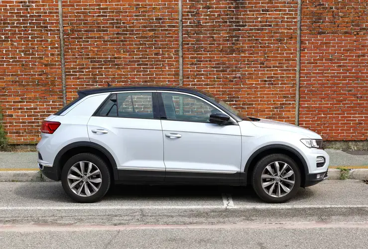 VW T-Roc in front of brick wall
